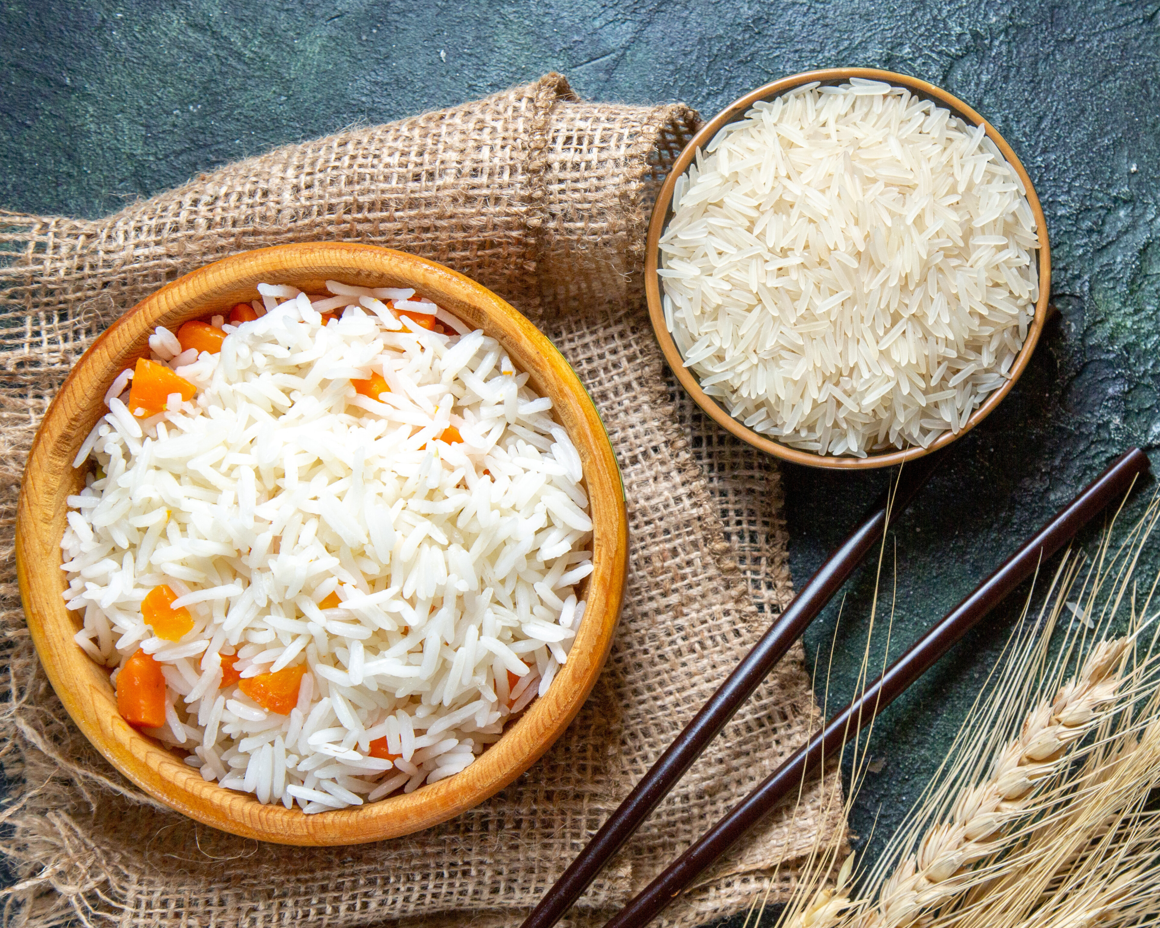 Top View Delicious Boiled Rice with Raw Rice inside Little Plate on Dark Background Fish Color Food Dinner Meal - Edited